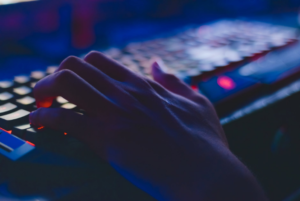 a person's hand on the keyboard